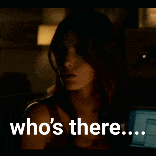 a woman in a dark room with the words who 's there on the bottom