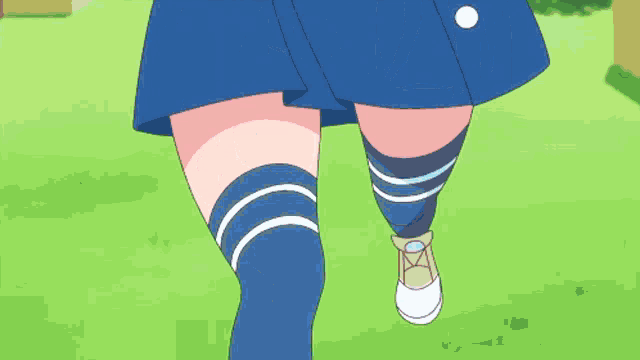 a woman in a blue skirt is holding a pink object