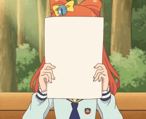 a girl with red hair is holding a piece of paper over her face