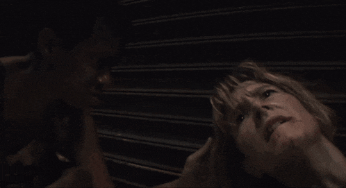a man holds a woman 's head and says it 's okay you dying is all