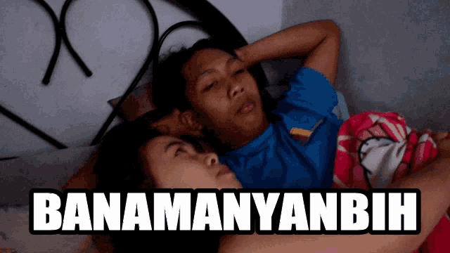 a man and a woman laying on a bed with the words " banamanyanbih " written above them