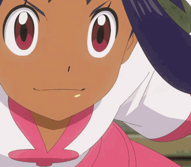 a close up of a girl 's face with a pink collar