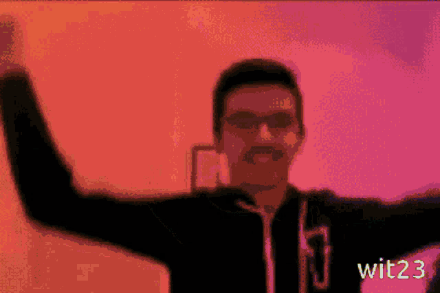 a pixelated image of a man with his fist in the air with wit23 written below him