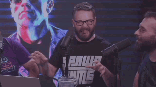 a man wearing a shirt that says paw game on it