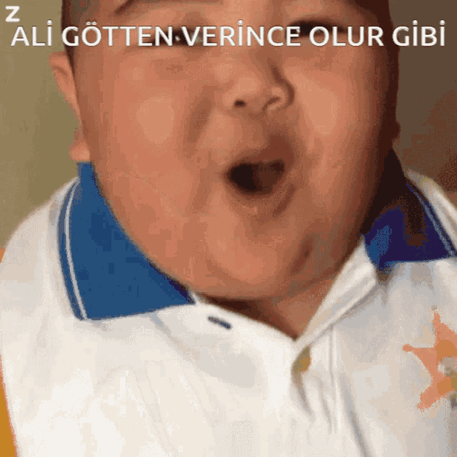 a close up of a baby 's face with the words ali gotten verince olur gibi above him