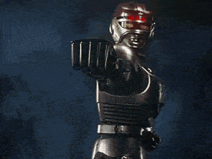 a robot is standing in a dark room with smoke coming out of his fist .