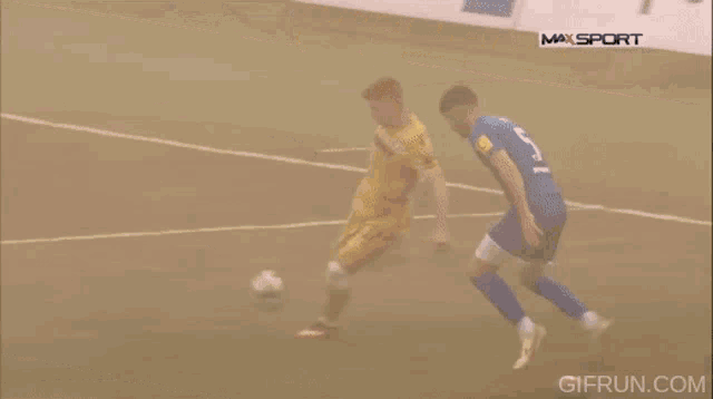 a group of soccer players on a field with a maxsport ad in the background