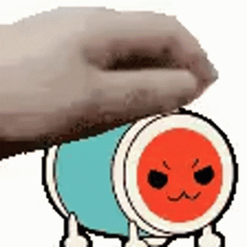 a person is putting their hand on top of a cartoon drum with an angry face .
