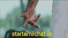 a man 's hand is reaching out towards another man 's hand with the website starttamilchat.in written below it