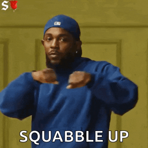 a man wearing a blue hat and a blue hoodie says squabble up