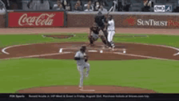 a baseball game is being played in front of coca cola and suntrust signs