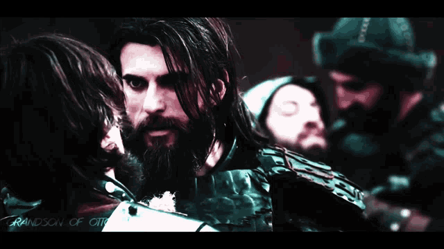 a man with a beard and long hair is surrounded by other men with the words grandson of otto written on the bottom