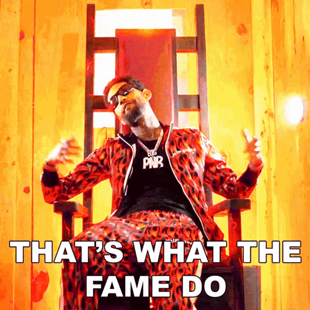 a man is sitting in a chair with the words that 's what the fame do
