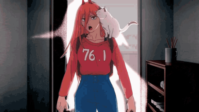 a girl with a cat on her shoulder wears a red sweater that says 76.1