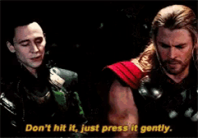two men are standing next to each other and one of them is saying " don 't hit it , just press it gently . "