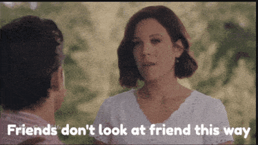 a man and a woman are looking at each other with the words " friends don 't look at friend this way " above them