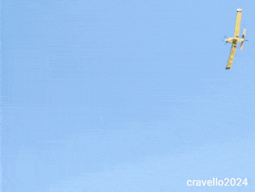 a plane is flying over a field and the year 2024 is on the bottom