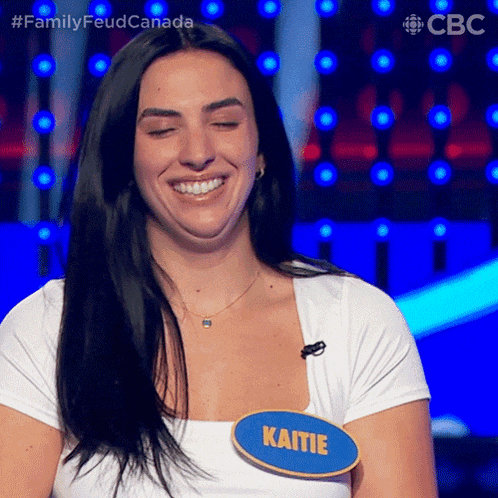 a woman with a name tag that says kaitie is smiling
