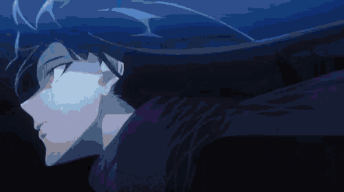 a close up of a person 's face in the dark