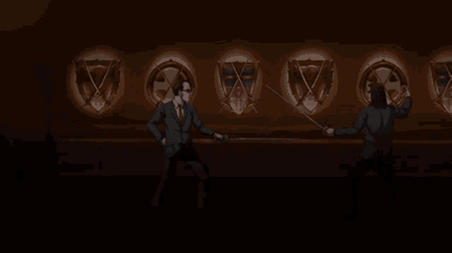 a man in a suit and tie is holding a sword in front of a shield