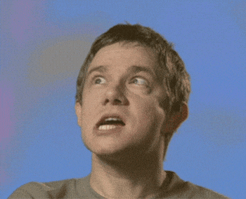 a close up of a man 's face against a blue background