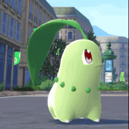 a green and white cartoon character with a leaf on its head