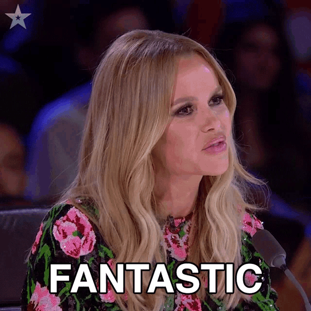 a woman sitting in front of a microphone with the word fantastic written on her face