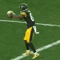 a football player wearing a number 8 jersey is throwing a ball
