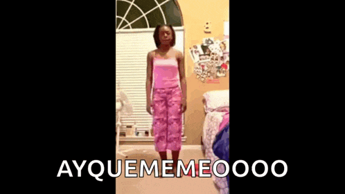 a little girl is dancing in a bedroom with the words ayquememeooo behind her .