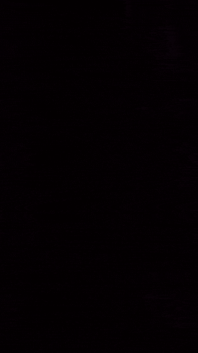 a close up of a cartoon character 's face with a dark background .