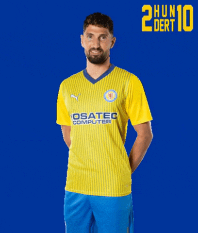 a man is wearing a yellow shirt that says osatec computer