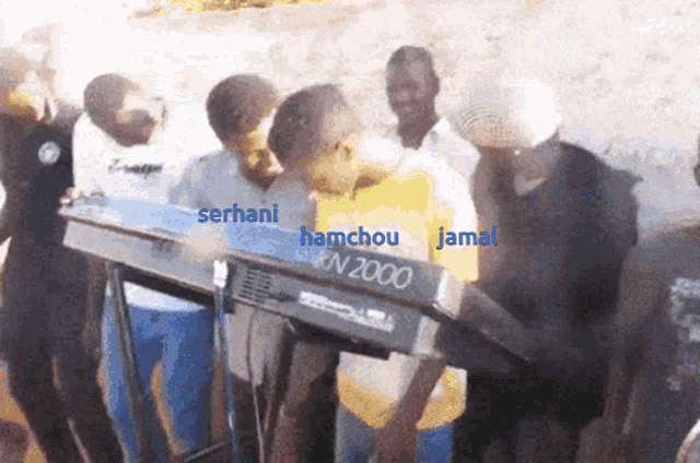 a group of people are standing around a keyboard that says n2000