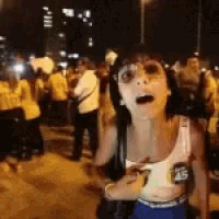 a woman in a white tank top with the number 45 on it