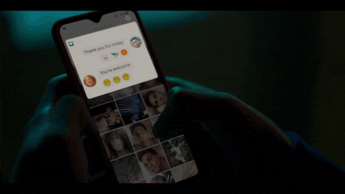 a person is holding a cell phone with a collage of photos on it