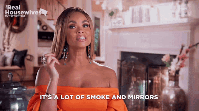 a woman in an orange dress is talking about smoke and mirrors