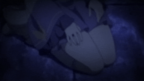 a close up of a person 's feet in a dark room with a blue background .