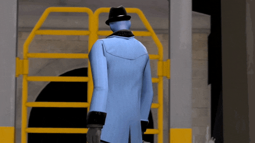 a man in a blue coat and hat is standing in front of a yellow gate
