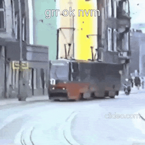 a bus is driving down a city street next to a motorcycle .