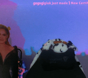 a woman is standing in front of a screen that says gogoigiuk just made 1 new certifi