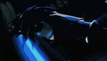 a close up of a person 's arm with a blue light coming from it