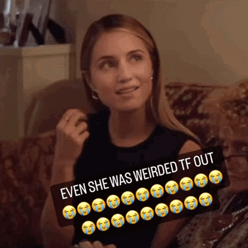 a woman sits on a couch with a sticker that says even she was weirded tf out