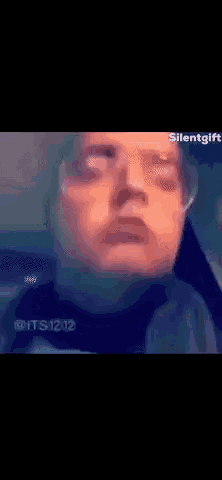 a blurry picture of a man 's face with the words silent gift written on the bottom