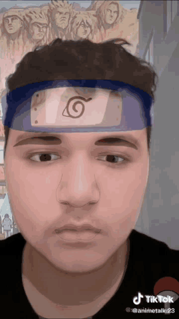 a man wearing a headband with a symbol on it