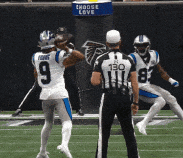 a football player with the number 9 on his jersey throws the ball