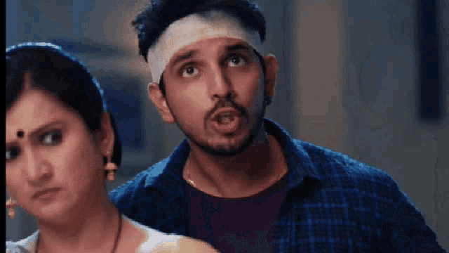 a man with a bandage on his head looks at the camera