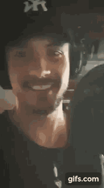 a close up of a person 's face behind a glass .