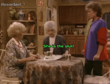 three older women sitting at a table with the words she is the slut in the upper right corner