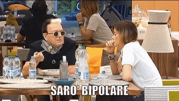 a man and a woman are sitting at a table with the words " saro bipolare " on the bottom