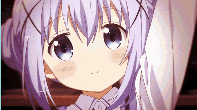 a little girl with purple hair and blue eyes looks at the camera