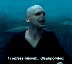 a bald man is standing in the water and says i confess myself disappointed .